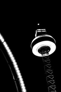 Illuminated ferris wheel at night