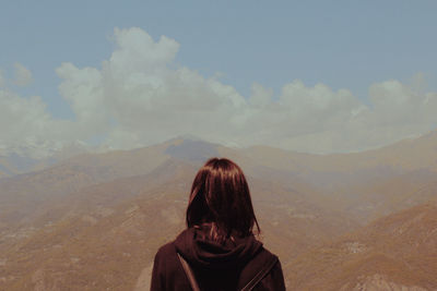 Rear view of woman against mountain