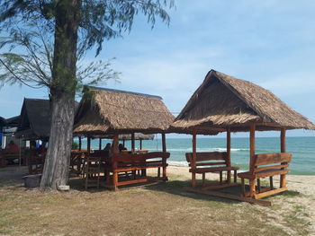 Built structure on beach against sky