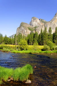 Scenic view of land against clear blue sky