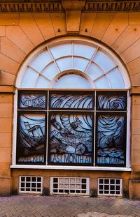 Low angle view of glass window in building