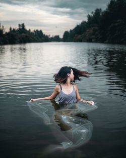 Young woman in river