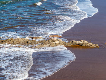 High angle view of rocks on beach