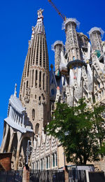 Low angle view of buildings against blue sky