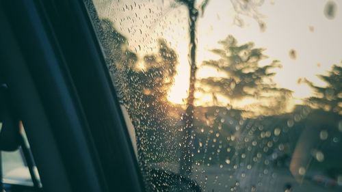 Raindrops on glass window in rainy season