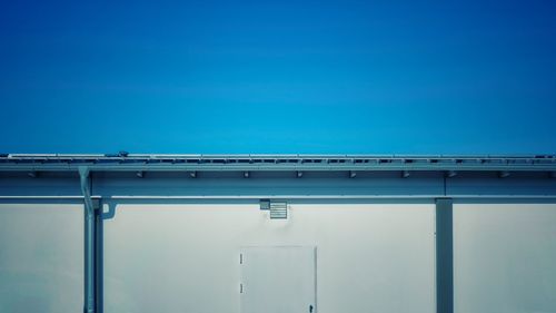 Low angle view of building against clear blue sky