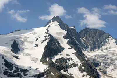 Scenic view of snow covered mountain against sky