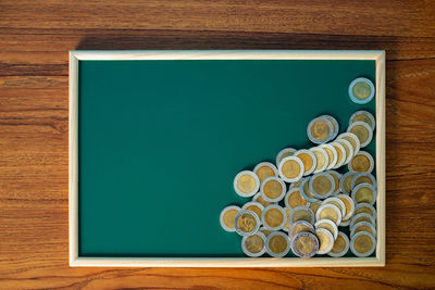 High angle view of coins on table