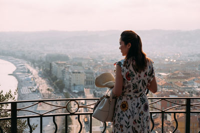 Woman looking at cityscape