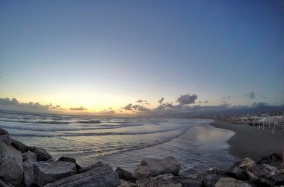 Scenic view of sea against sky during winter