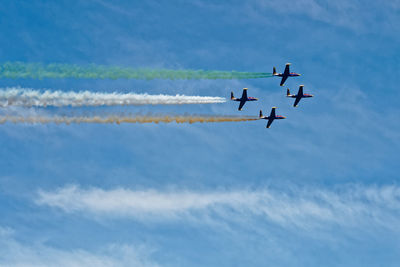 Low angle view of airplane flying against sky