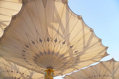 Low angle view of umbrella against clear sky