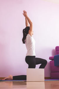 Young woman exercising in gym