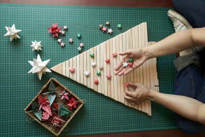 Creating christmas tree with origami ornaments