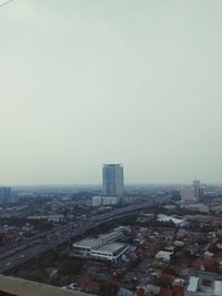 High angle view of city buildings against clear sky