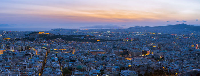 High angle view of city at sunset