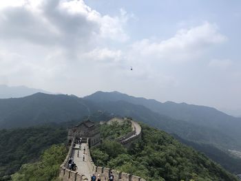 Scenic view of mountains against cloudy sky