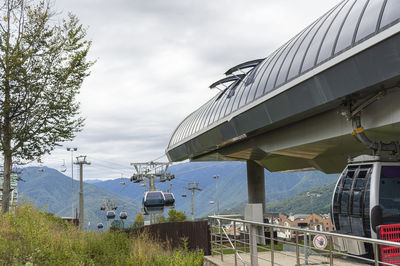 Lifts of the mountain cable car on the background of mountains