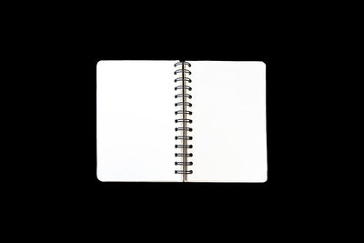 Low angle view of book against black background