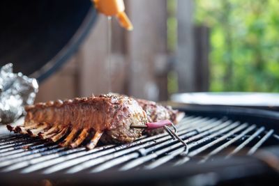 Close-up of meat on barbecue grill