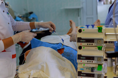 Doctors treating patient in operating room