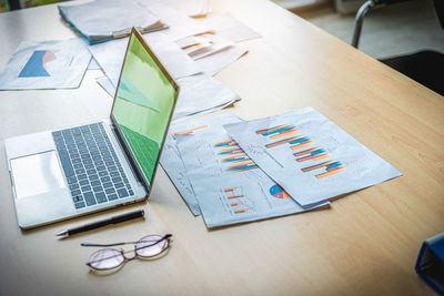 High angle view of business colleagues working on table