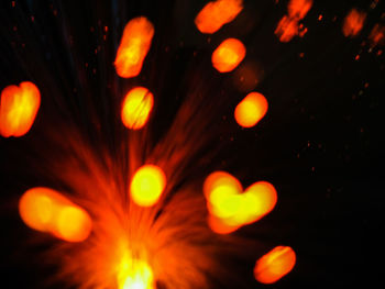 Defocused image of illuminated lights at night
