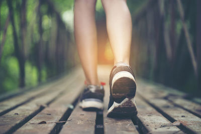 Low section of woman wearing shoes outdoors