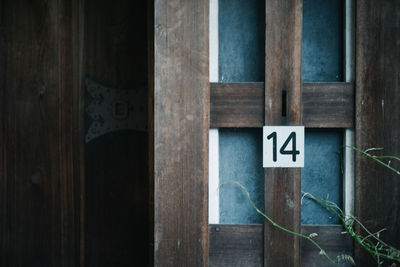 Close-up of text on wooden door