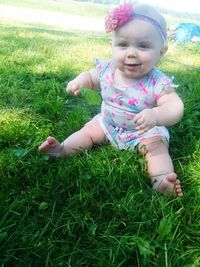 Cute baby girl on field