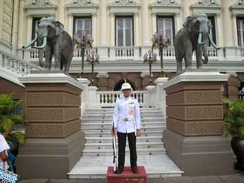 Man standing statue against building