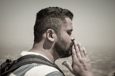 Portrait of young man looking at camera