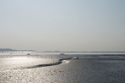 Scenic view of beach against clear sky