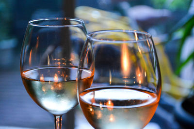Close-up of wine in glasses on table