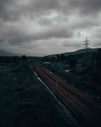 High angle view of empty railroad tracks at dusk