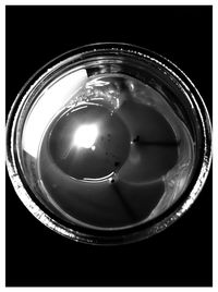 Close-up of hand over black background