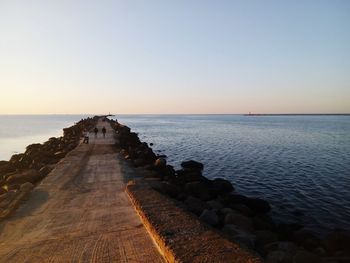 Scenic view of sea against clear sky during sunset