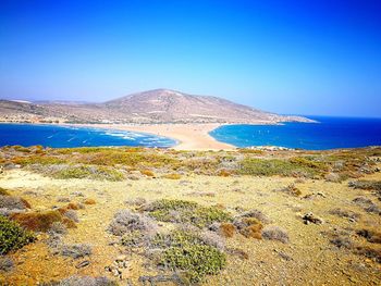 Scenic view of sea against clear blue sky