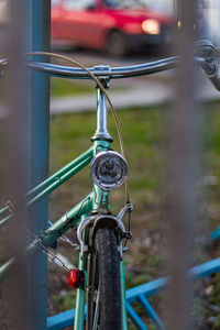 Close-up of bicycle on railing