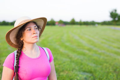 Portrait of a girl looking away on field