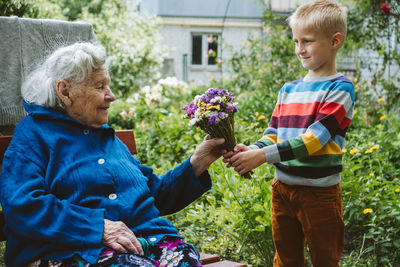 Reunited, family, togetherness, relationships, meeting, embracing. grandson visit grandmother