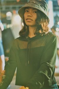 Portrait of young woman in hat
