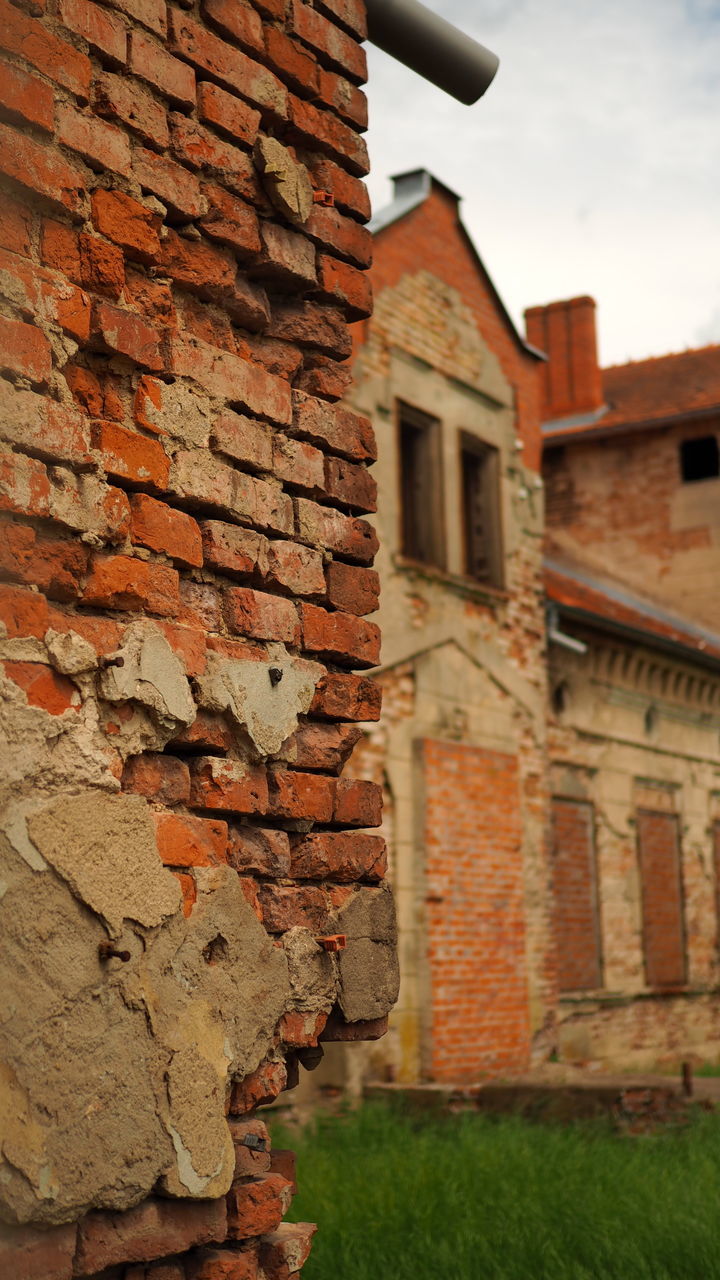 BRICK WALL OF OLD HOUSE