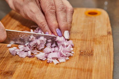 Cropped image of man preparing food on table