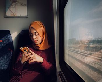 Woman sitting in train