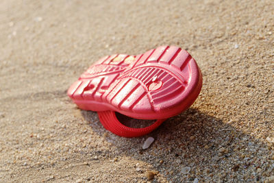 Close-up of red object on ground