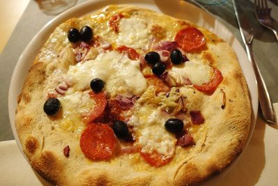 High angle view of pizza served on table