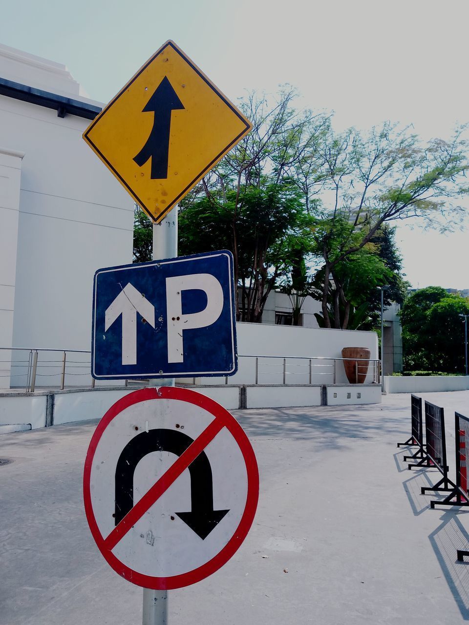 ROAD SIGNS AGAINST CLEAR SKY