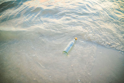 High angle view of toy floating on sea