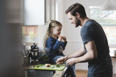 Father and son on cutting board